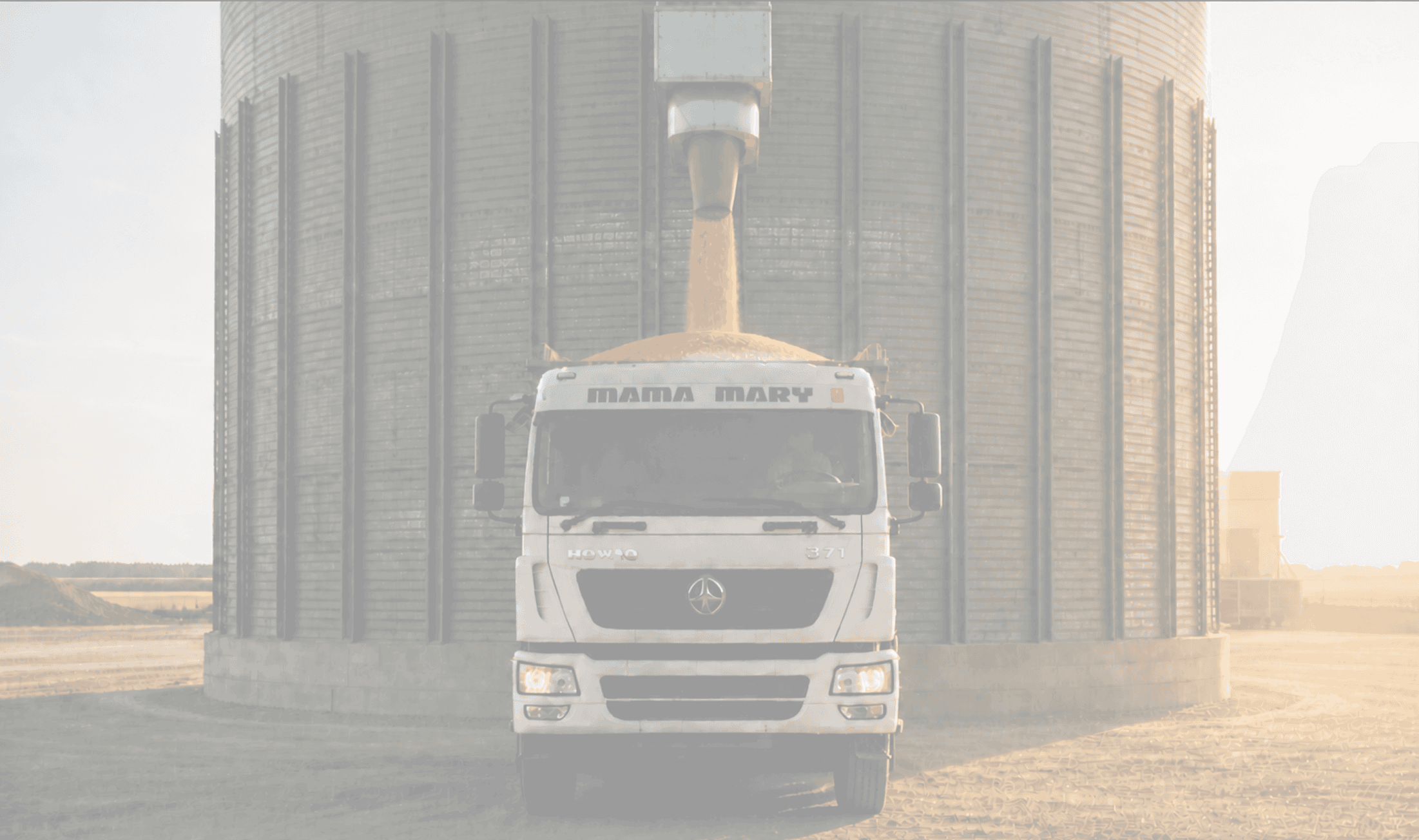 dumptruck hauling corn from a silo chute